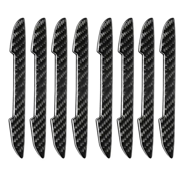 Black carbon fibre texture car door edge protector strips laid out flat.