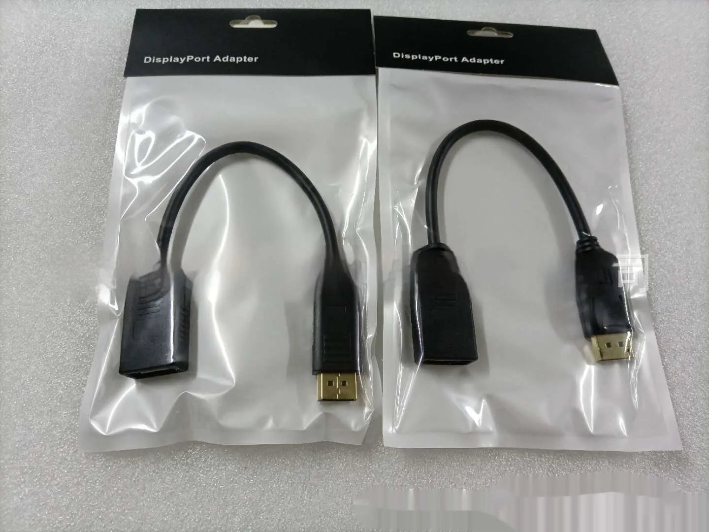 Black Display Port DP male to female extension cable approximately 10cm long with rotating adapter