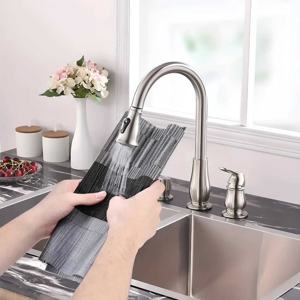 Non-slip PVC dish mat in gradient bamboo pattern protecting a kitchen countertop.