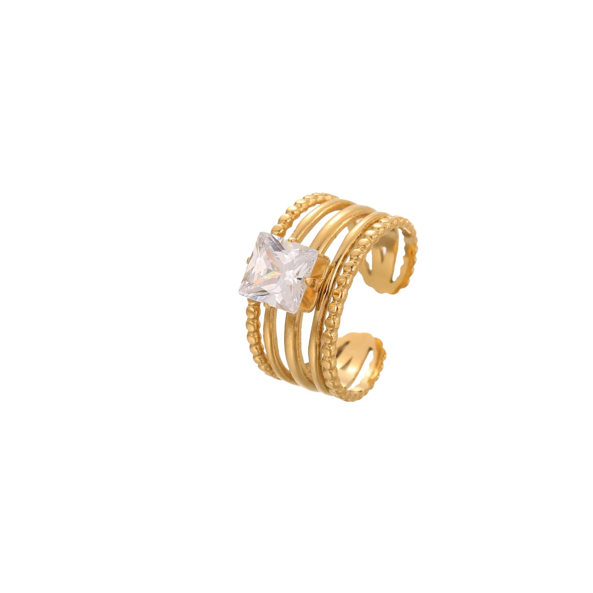 Gold electroplated stainless steel ring with zircon details in heart and geometric shapes on a grey background.