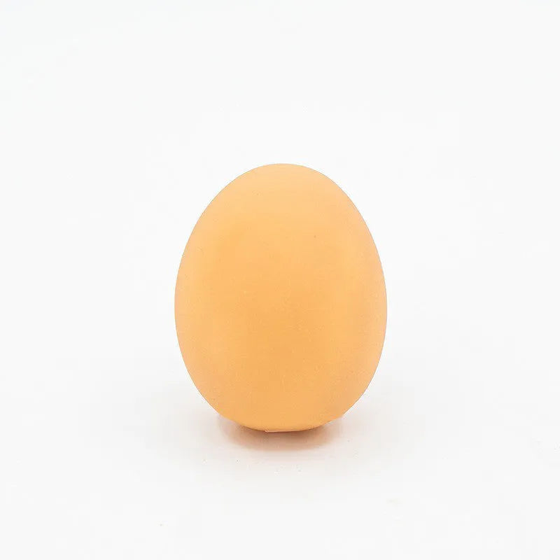 Natural rubber egg-shaped dog chew toy with a squeaker inside for dental play.