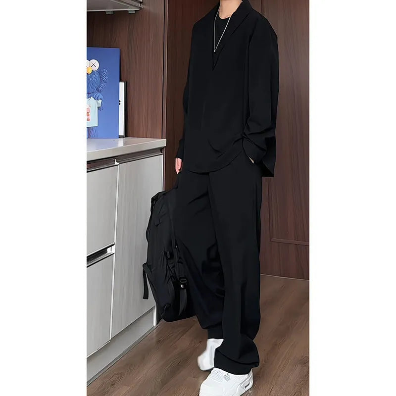 Men's black casual two-piece suit with long sleeve polo shirt and matching trousers slim fit