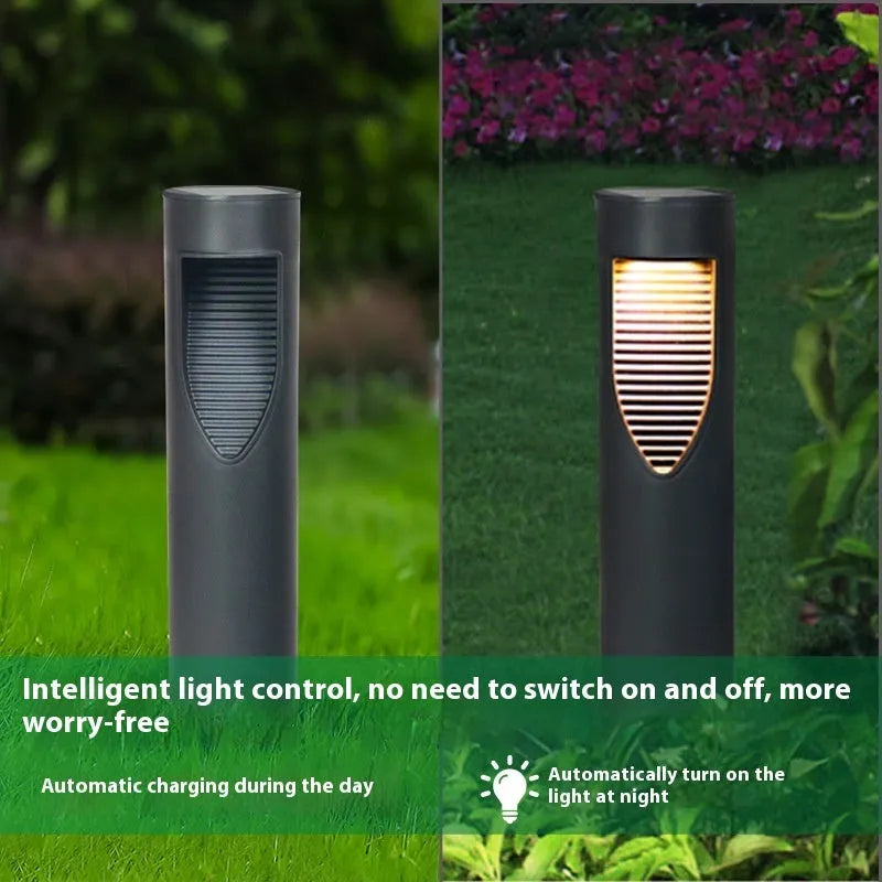 Black geometric abstract art solar-powered stainless steel garden lantern on grass.