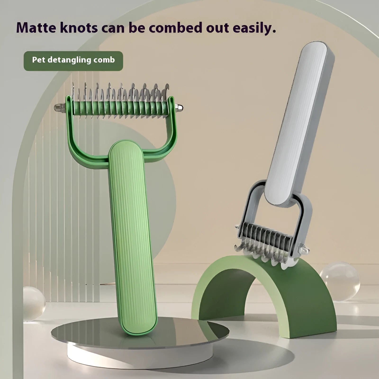 Green and grey dog detangling comb with stainless steel pins on a plastic handle, shown in small and large sizes.