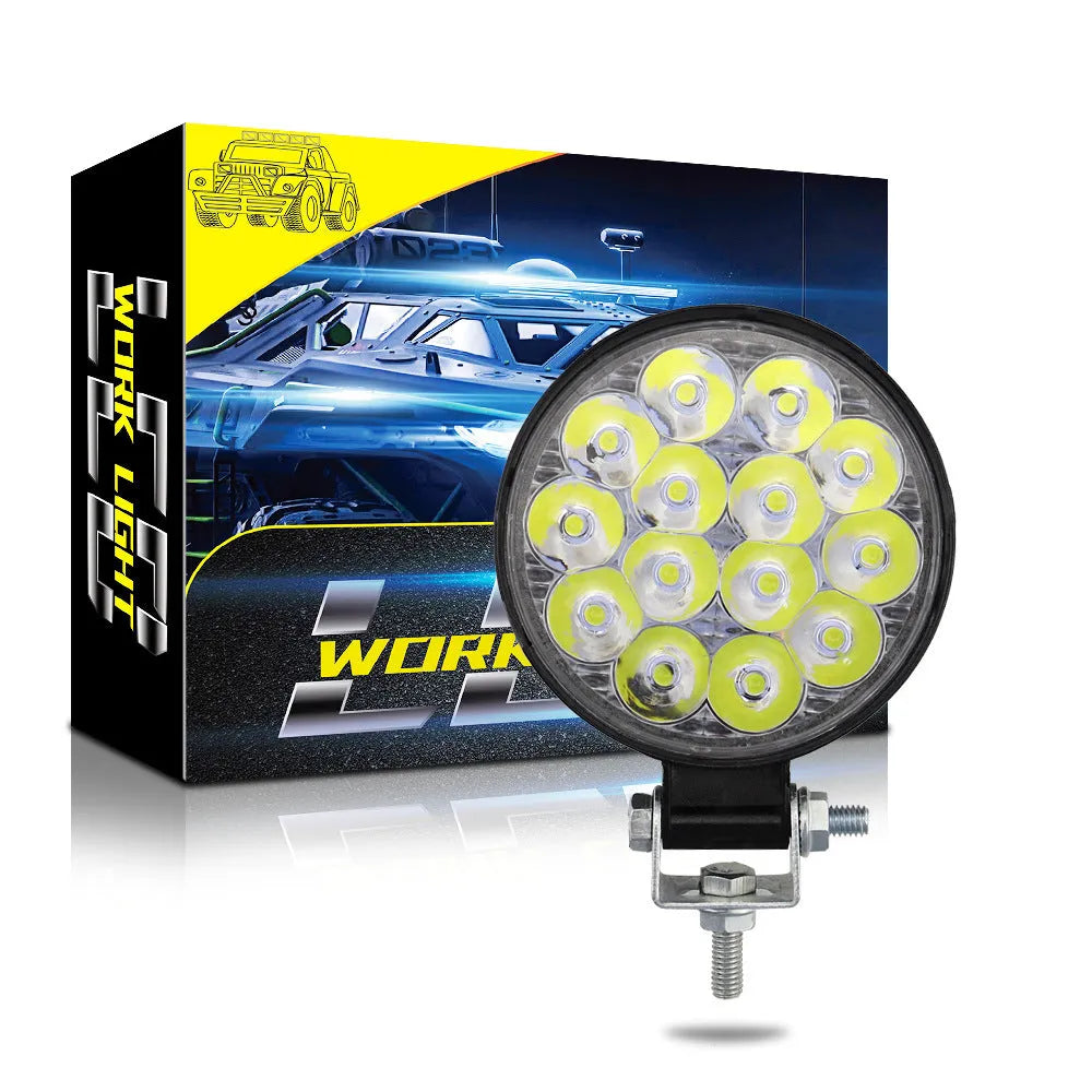 Round white LED work light with aluminium housing for vehicle mounting