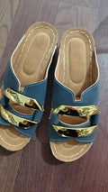 Roman style platform flip-flops in black with metal accents and rubber sole.