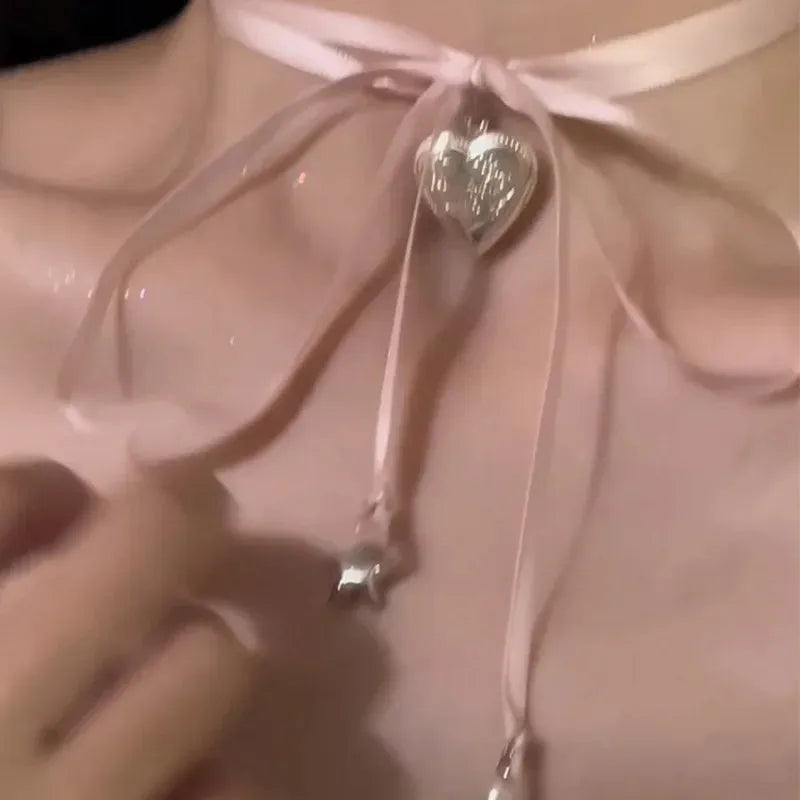 Women's alloy necklace with ribbon love pendant and electroplated finish on clavicle chain