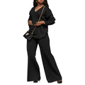 Women's brown thickened suede two-piece suit with split sleeve top and trousers on a hanger.