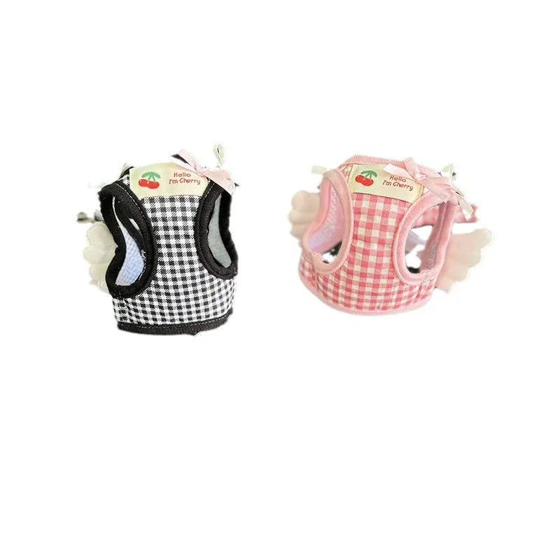 Small dog wearing pink cotton chest and back harness with integrated lead rope