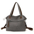 Grey retro-style canvas women's handbag with large capacity and internal pockets.