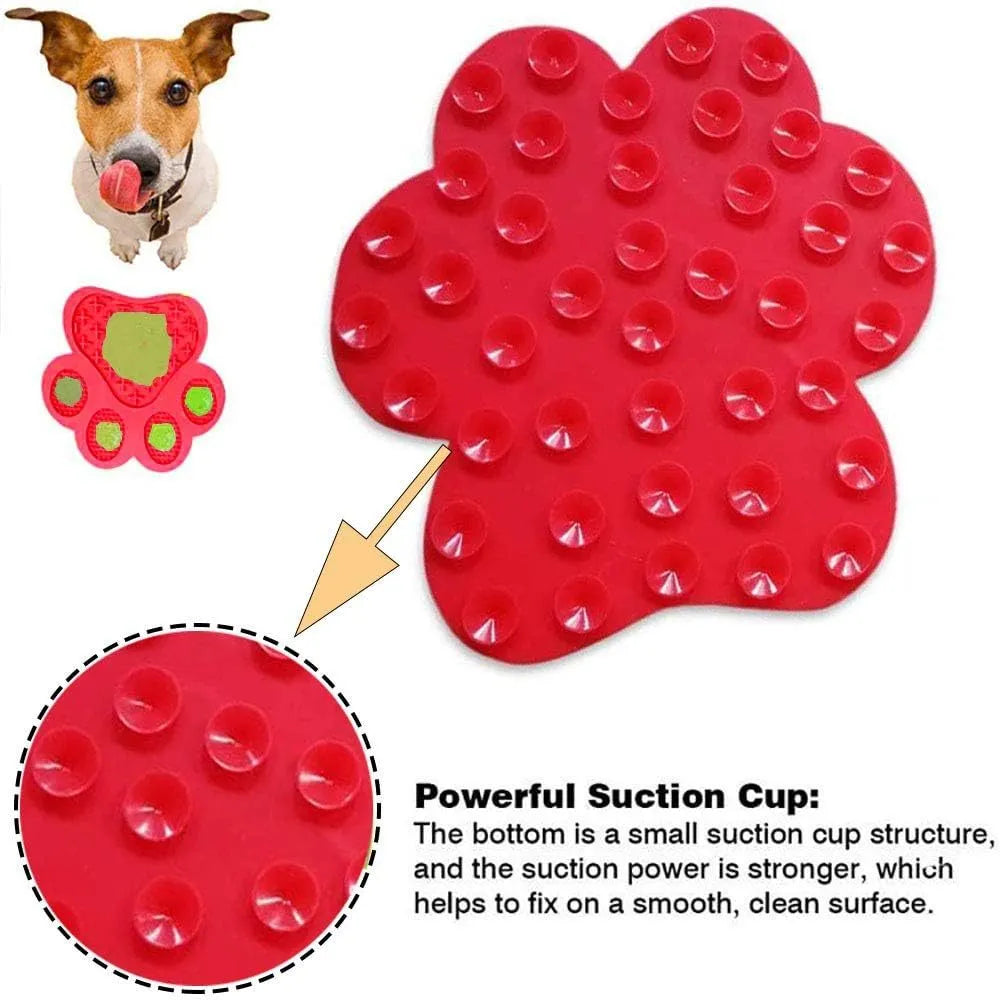 Blue bone-shaped silicone dog licking mat with suction cups on a white tile wall.