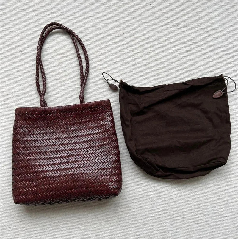 Woven vintage cowhide leather tote bag with three-dimensional outer pockets showing brown colour