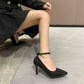 Women's black stiletto heel pumps with buckle detail and skull pattern lining