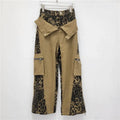 Women's dark khaki high waist jeans with a leopard print pattern and fake two-stitching tooling detail.