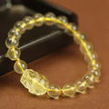 Yellow leather bracelet with a citrine crystal Pi Xiu charm in Chinese national style.