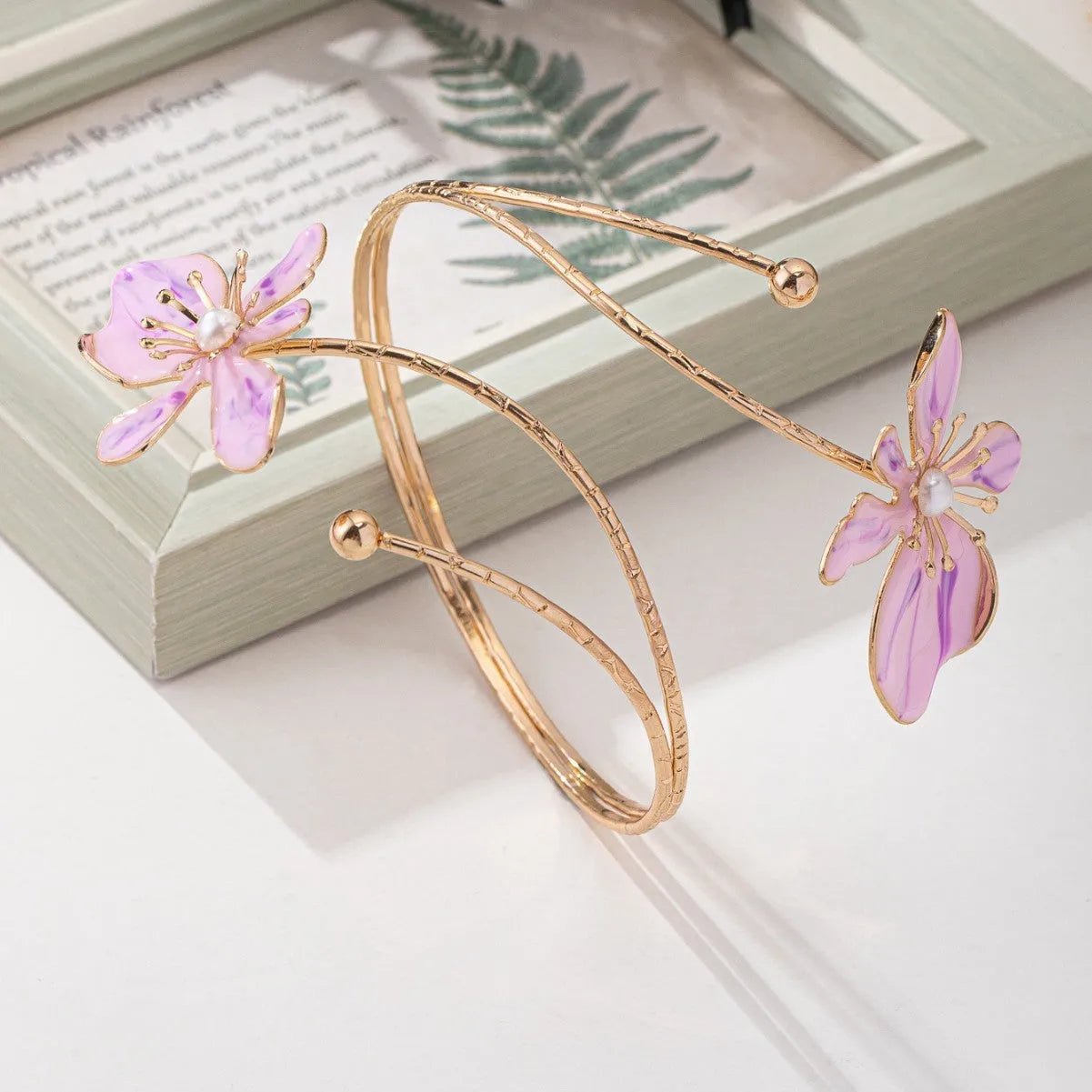 Personalised hollow pattern alloy armband in pink or purple colour with engraved lines.