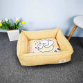 Square cloth pet bed with printed fabric finish, shown in one of five colours and available in 40x50cm or 50x60cm