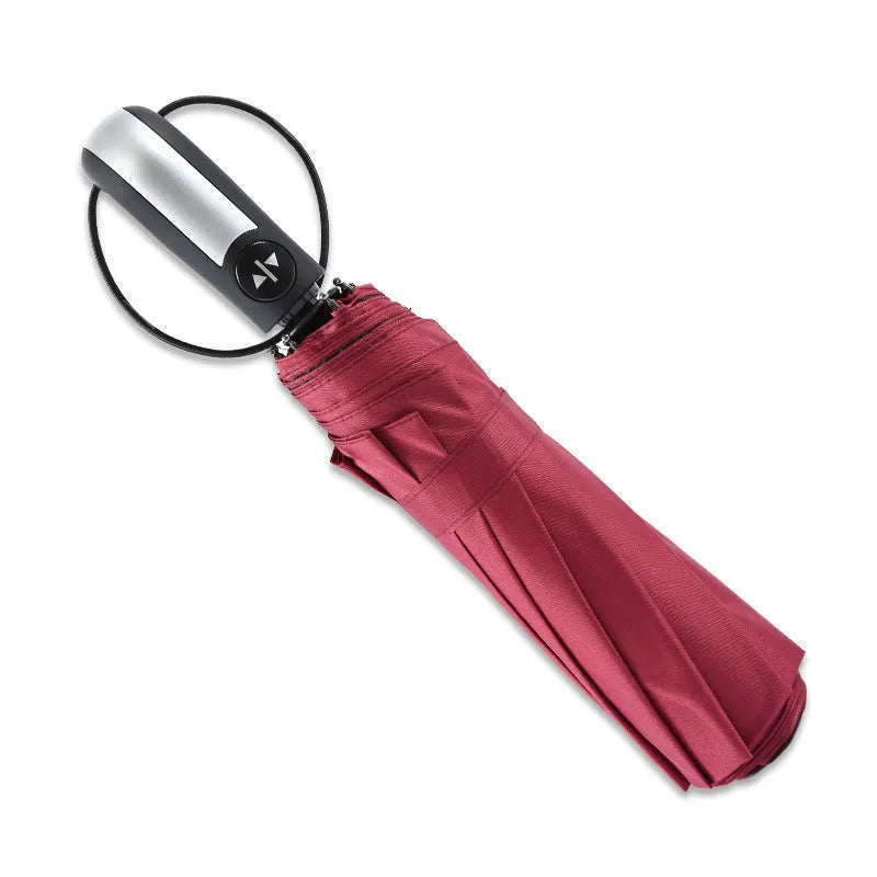 Black triple folding business umbrella with automatic opening mechanism and rubber handle
