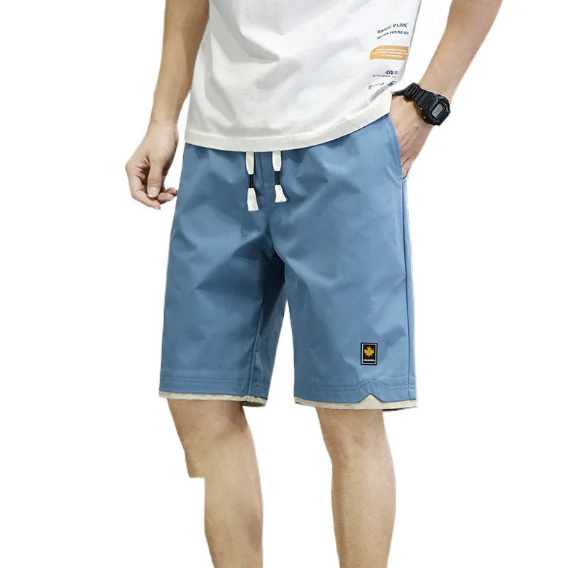Man's loose-fit casual beach shorts in khaki colour with elasticated waistband.