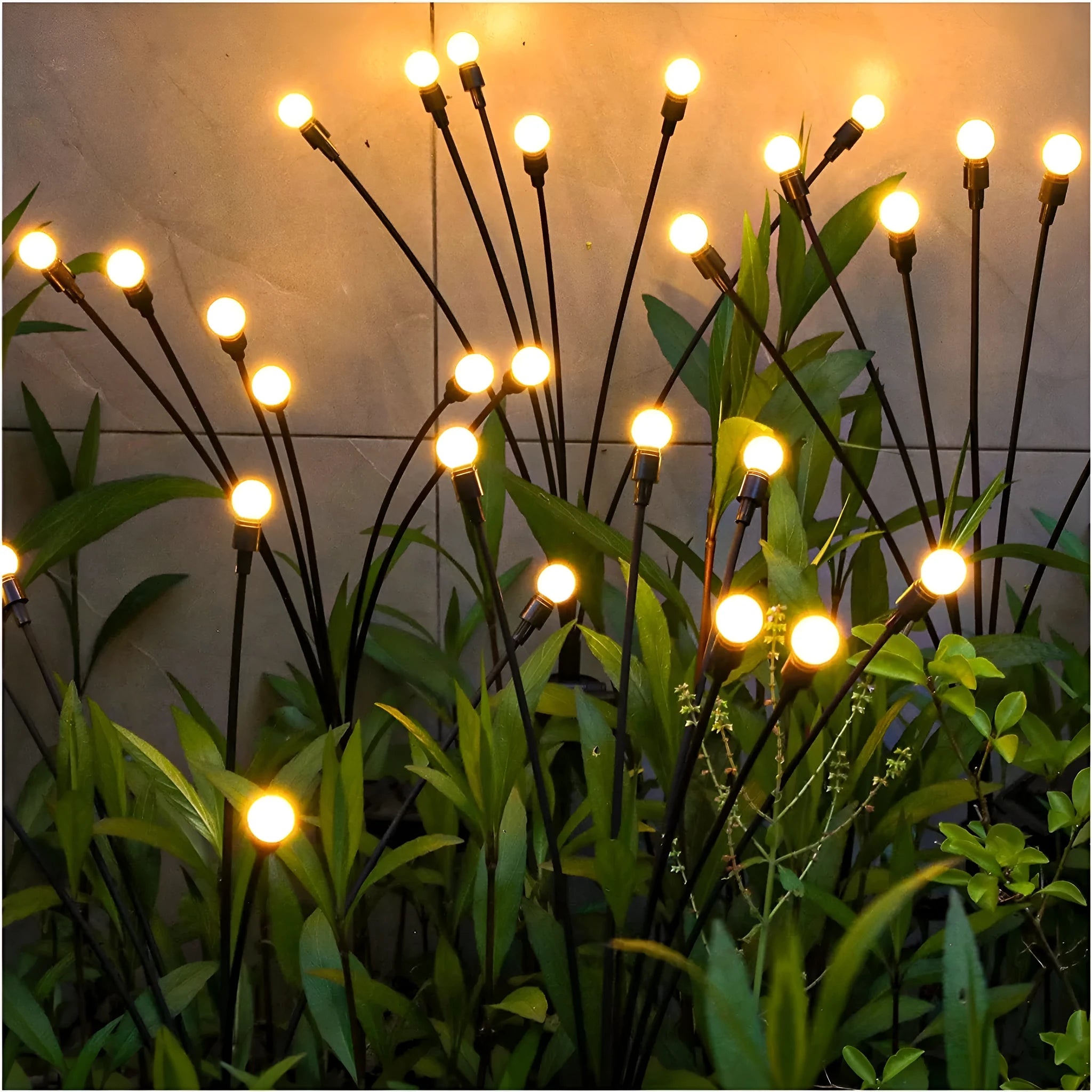 Solar powered LED ground spike garden light with multiple warm white and colour LED heads on stainless steel stake.