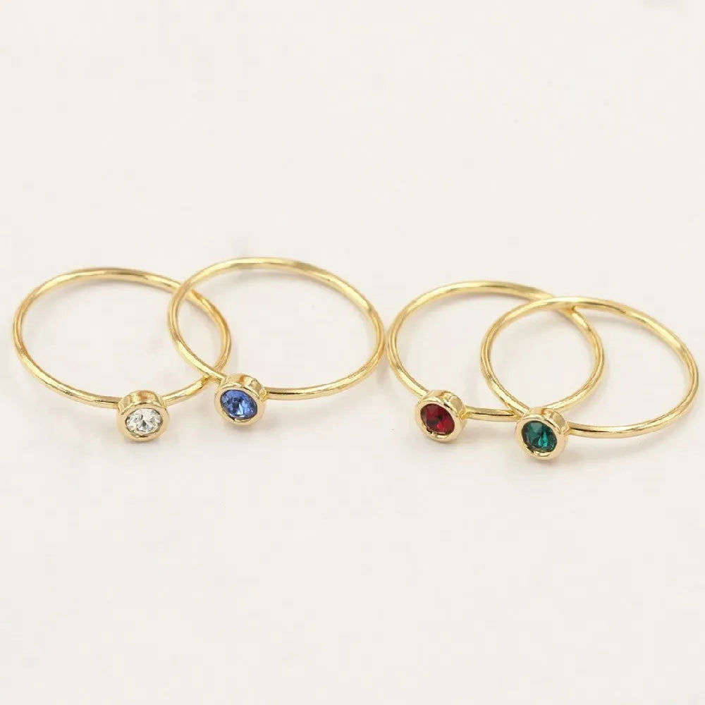 14K gilded women's knuckle ring with cubic zirconia stone in green, blue, dark red or white colours