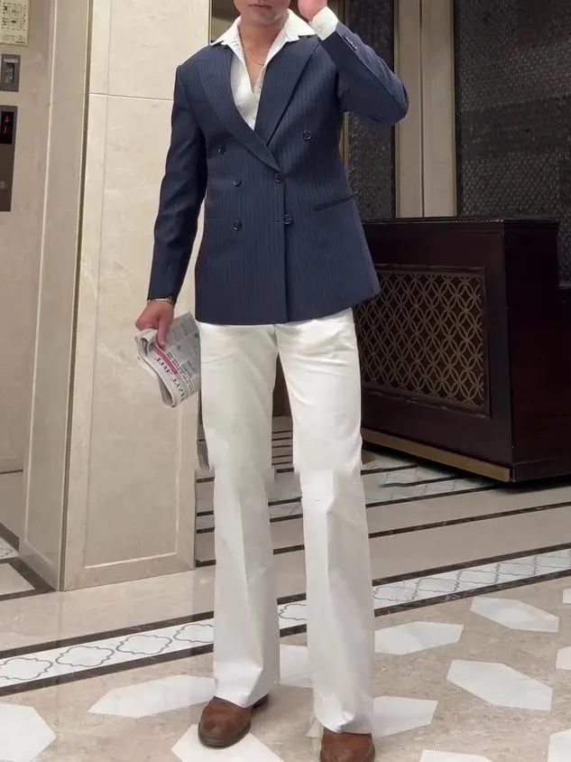 Men's striped double-breasted blazer showing regular fit and traditional tailoring details