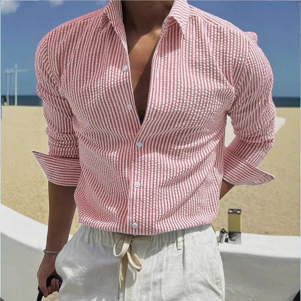Man's blue and white striped button-up shirt with a lapel collar and long sleeves.