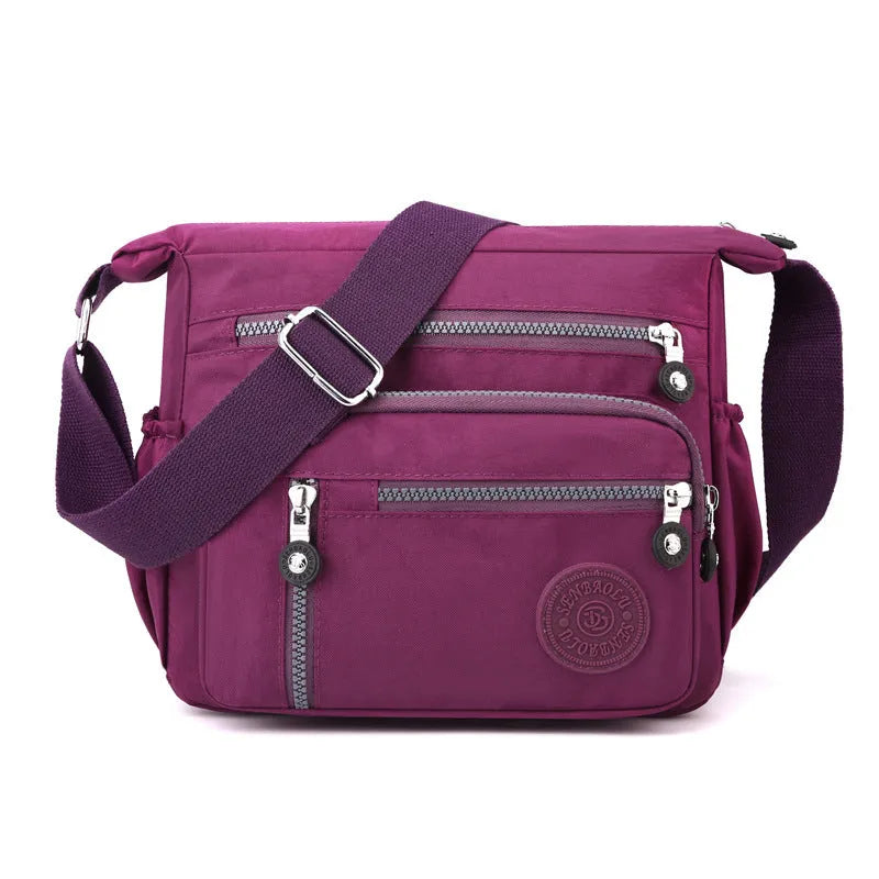 Soft nylon shoulder messenger bag in square vertical design, shown in grey colour.