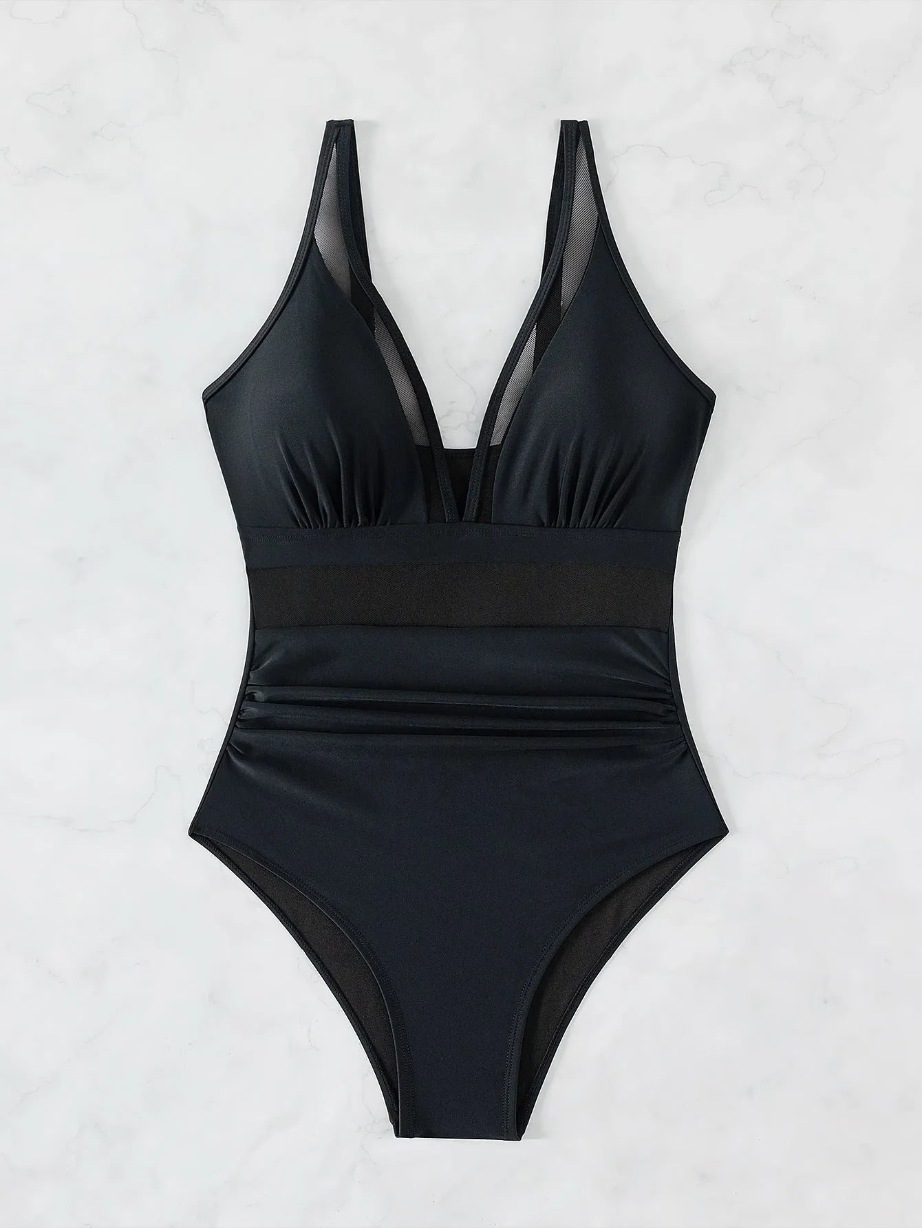 Black women's halter neck one-piece swimsuit with cross-back straps and briefs bottom.