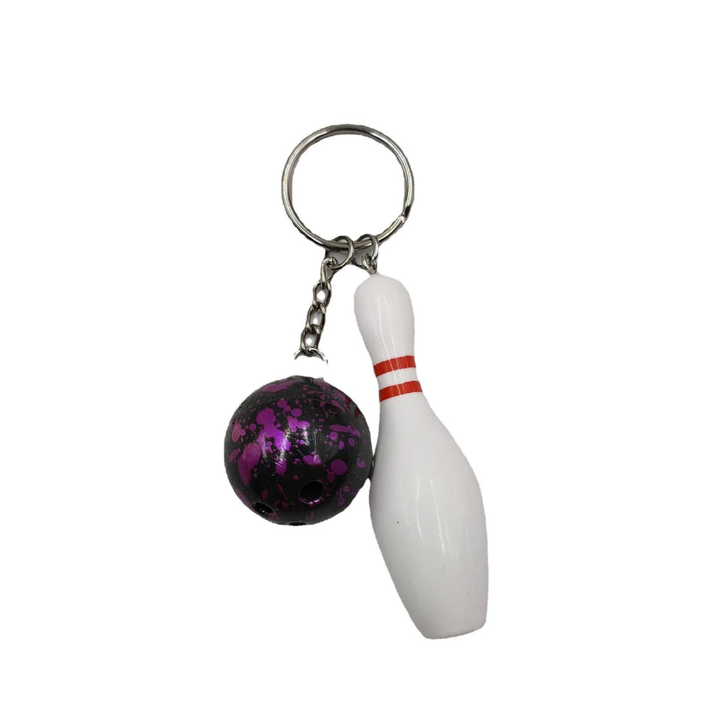 Mini bowling sports keychain pendant in four colour options: dark red, blue, purple, green