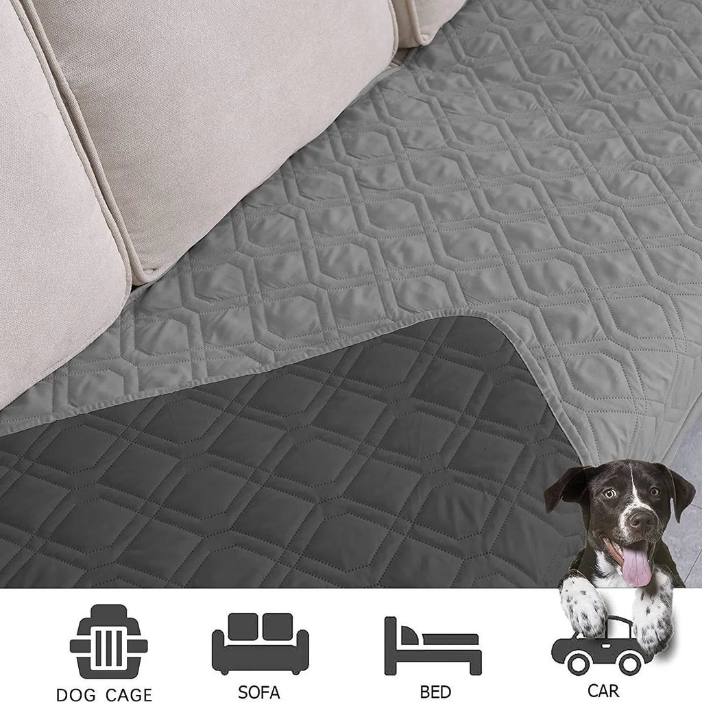 Reversible dog blanket on a sofa, showing two colour options, protecting furniture from pets.