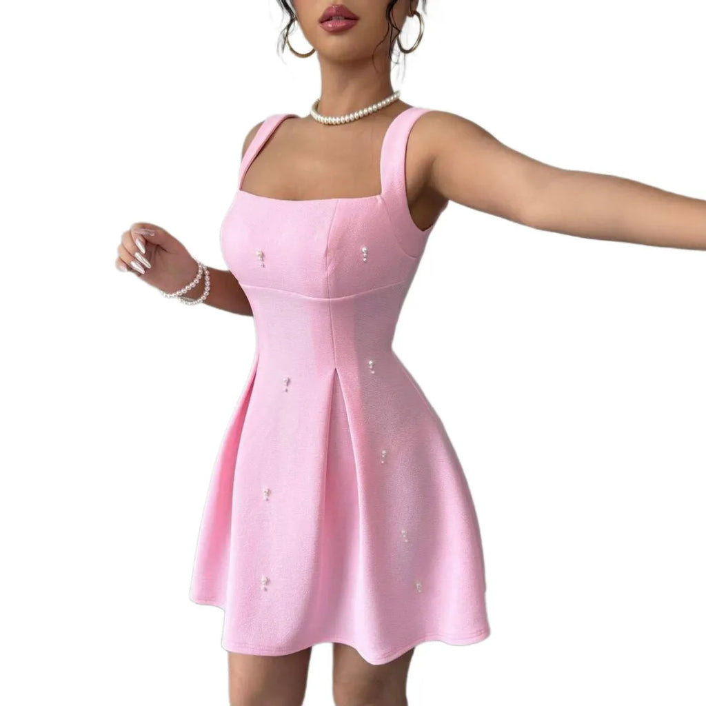 Pink high-waist suspender dress with A-line skirt and sleeveless design, made from polyester.