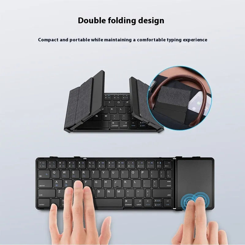 Black folding Bluetooth keyboard for mobile phones and tablets showing compact folded design