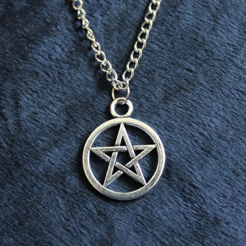 Vintage pentagram necklace with alloy pendant and adjustable chain in bronze colour on neutral background