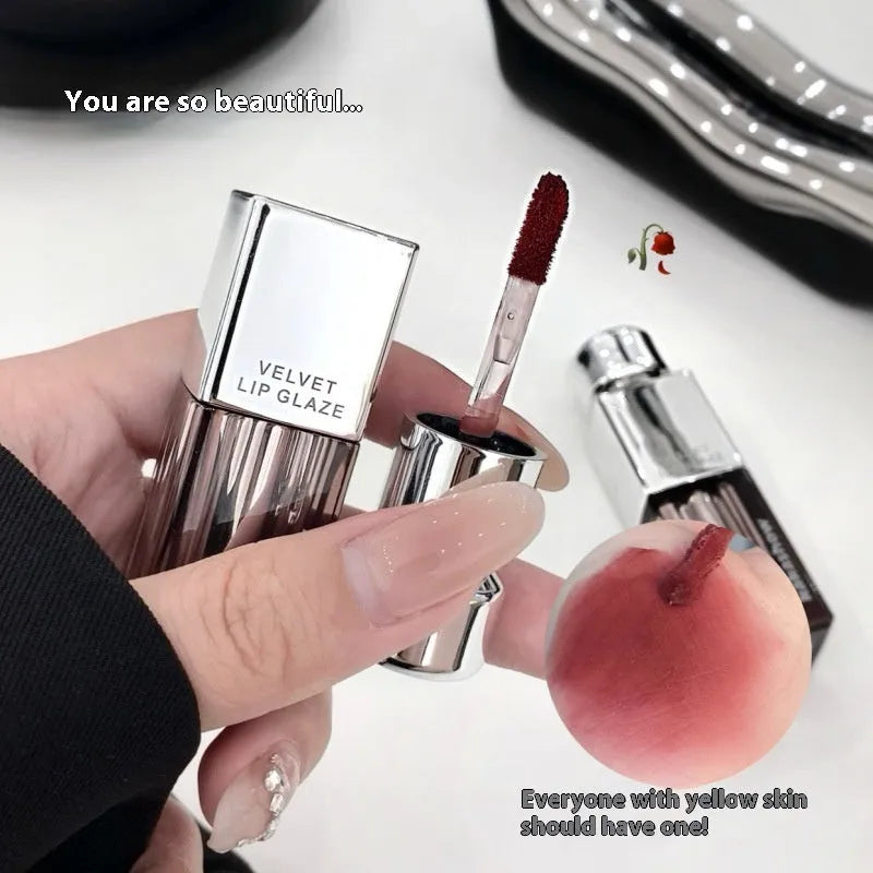 Matte soft mist lipstick in a case showing one of six shades including grey pink and oat brown.