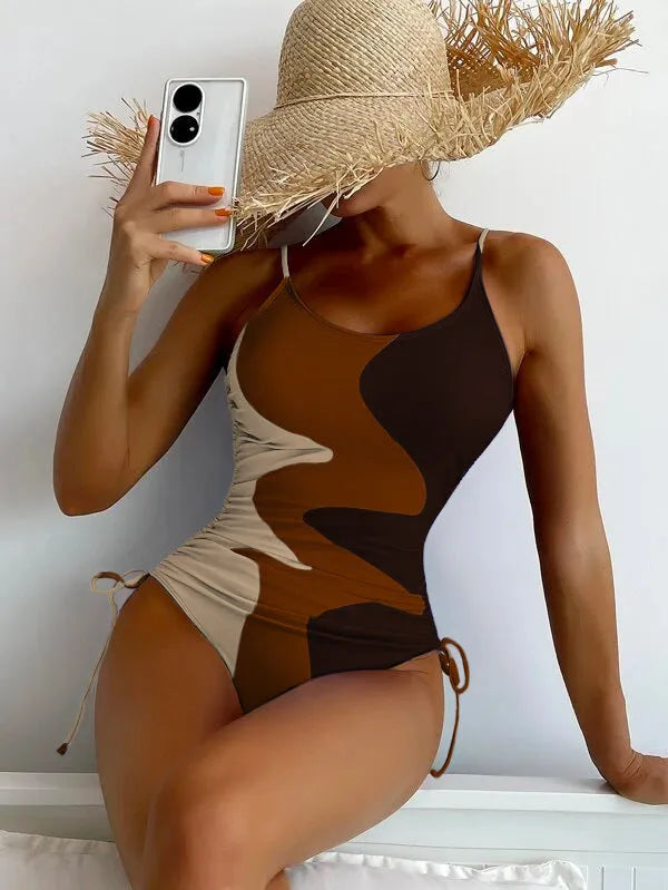 Women's blue sleeveless one-piece swimsuit with fixed swimming trunks on a white background.
