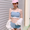 Solid colour women's one-piece swimsuit with suspender straps