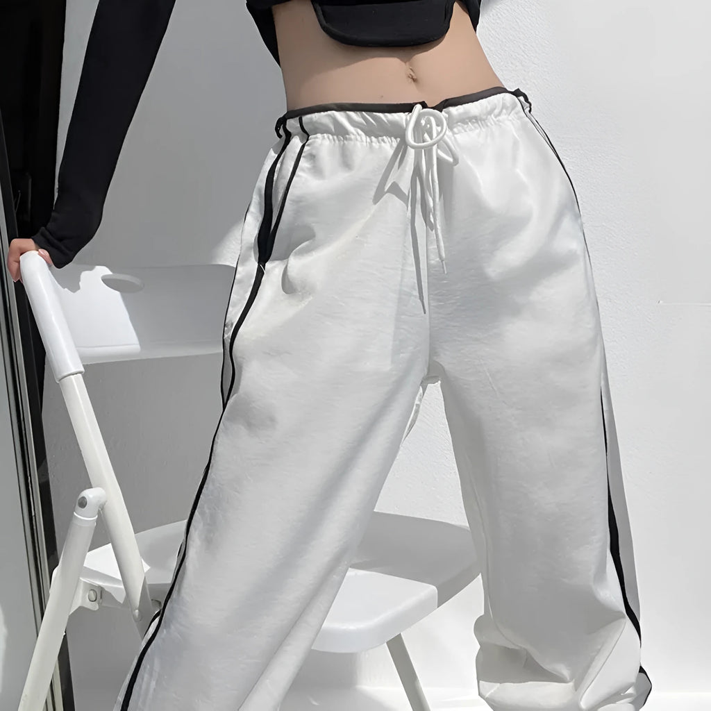 Women's loose straight-leg trousers with contrast ribbon parallel bars detail in navy blue
