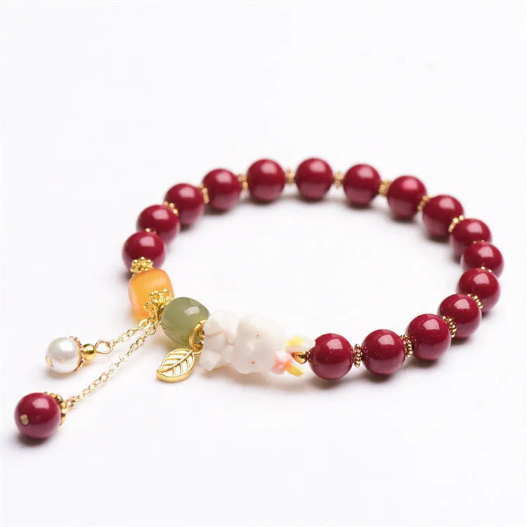 Natural cinnabar rabbit bracelet in national style design showing 8mm and 10mm size options