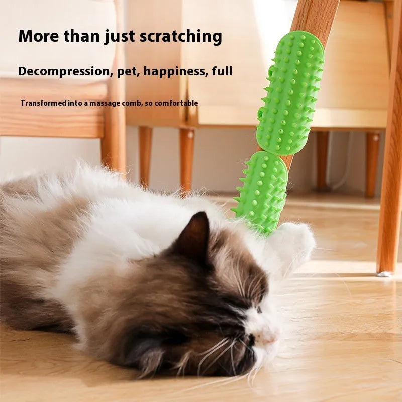 Silicone cat grooming massage comb with adjustable strap mounted on furniture leg