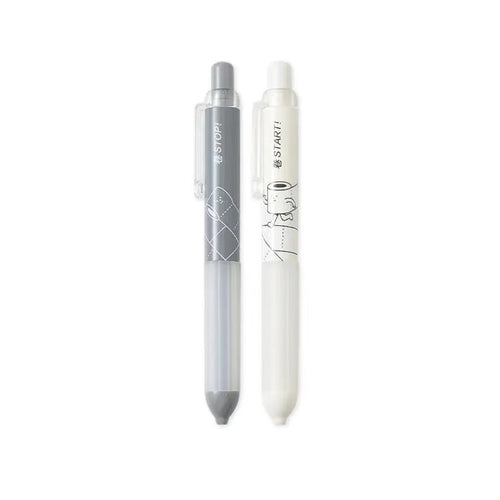 Black and white 0.5mm automatic pencils with cloud grip plastic holders on minimalist background