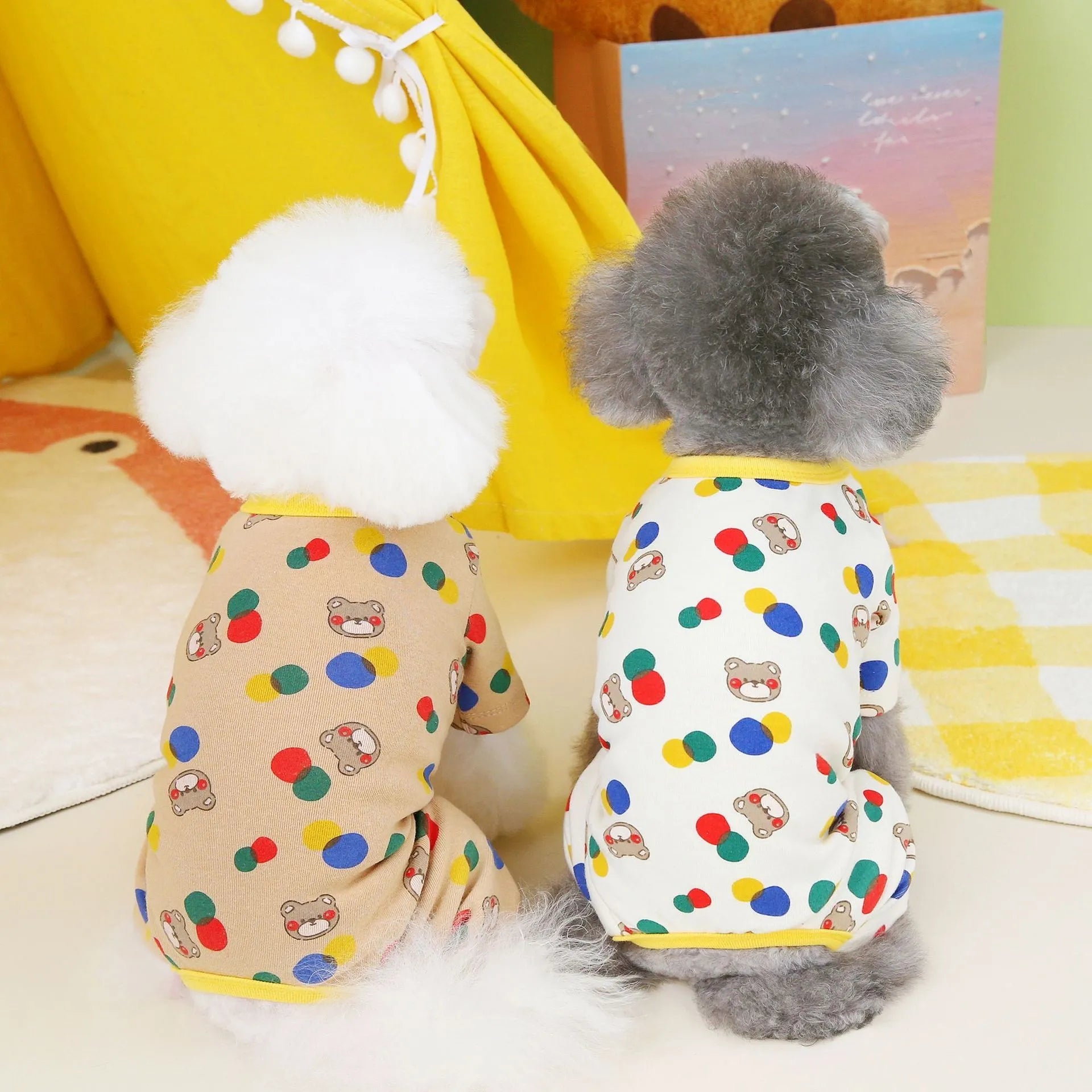 Beige dog jumper with colourful ball bear print, made from cotton and spandex.