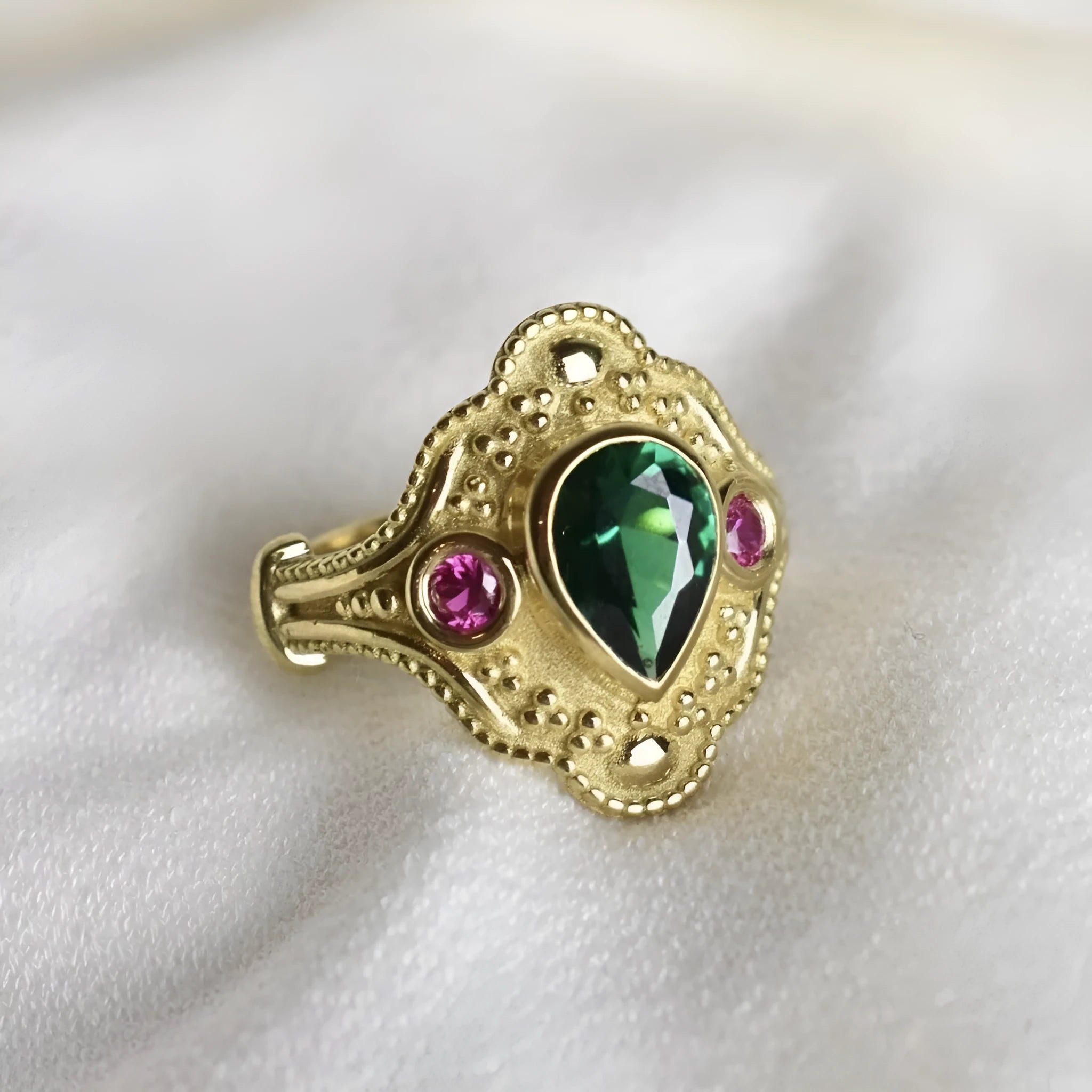 Golden geometric ins style women's alloy ring on a white background showing its electroplated finish.