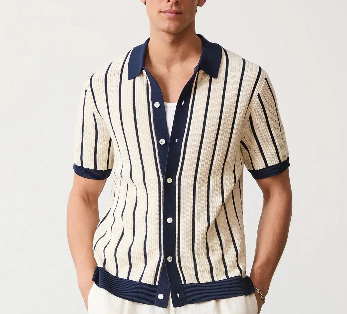 Men's white asymmetrical short sleeve knitted top with a lapel collar, shown on a model.