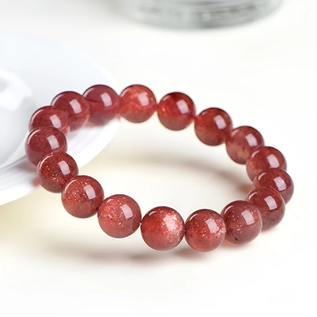 Strawberry quartz crystal bracelet with cherry red starlight colour and geometric beads