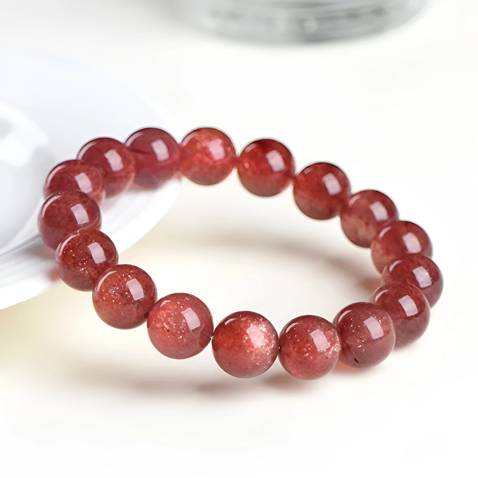 Strawberry quartz crystal bracelet with cherry red starlight colour and geometric beads