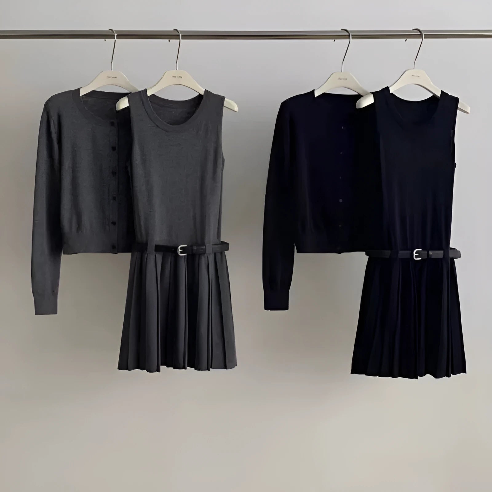 Grey art retro knitted vest skirt and long-sleeved cardigan two-piece set for women.
