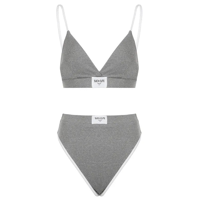 Women's grey polyester bikini set with embroidery detail and contrast binding, showing sleeveless top and shorts-length bottoms