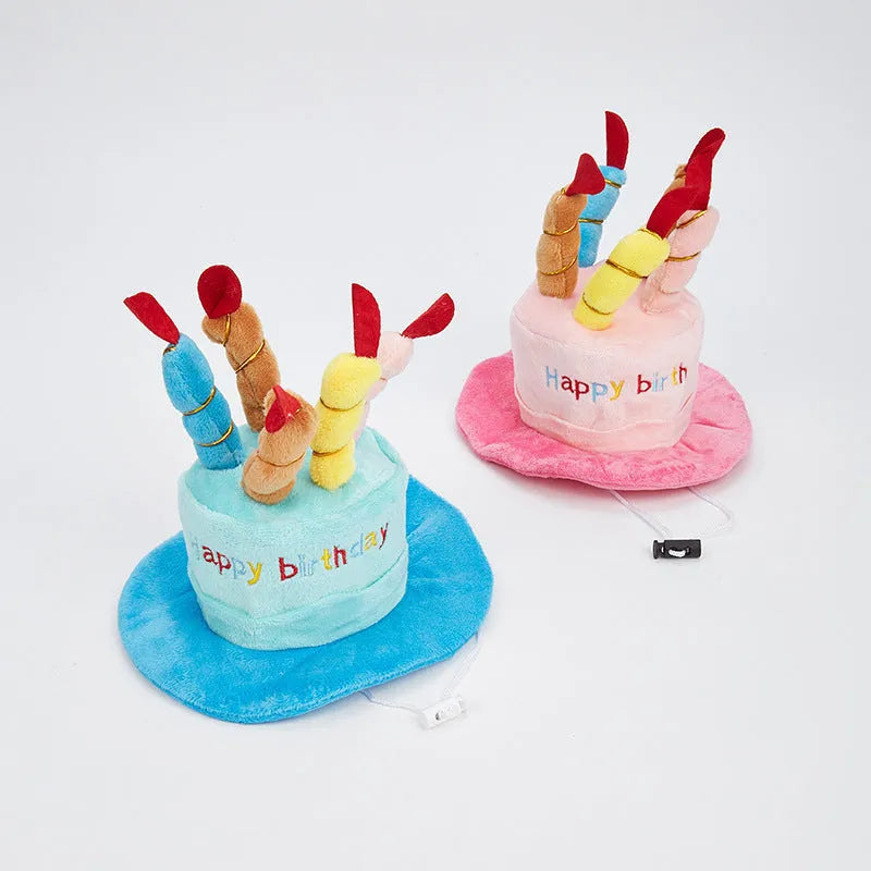 Blue and pink birthday hat for dogs on a white background.