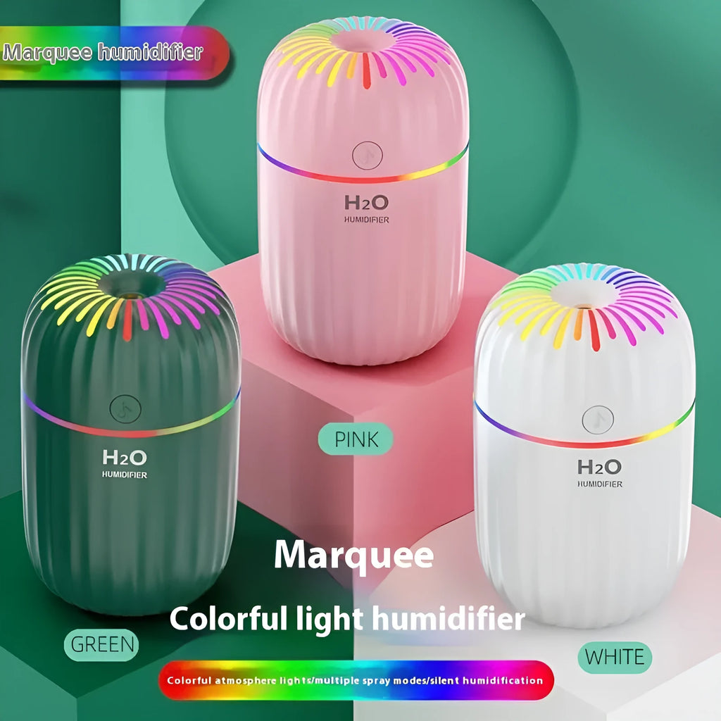 Mini animal-shaped USB aromatherapy humidifier in green, pink, or white, showing compact size.